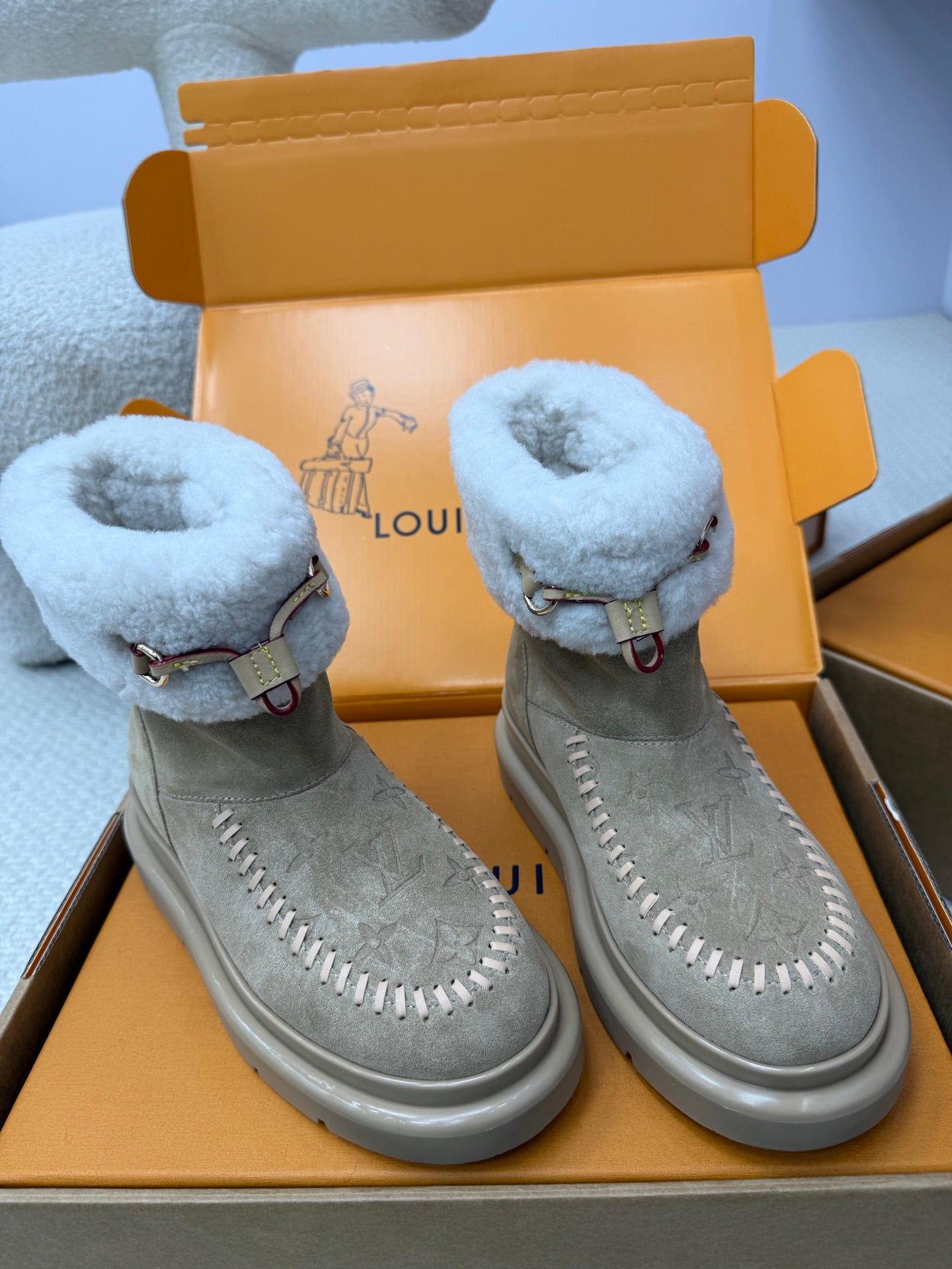 Louis Vuitton women's gray suede boots with light blue shearling cuffs and leather strap detail