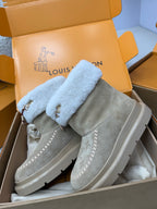 Louis Vuitton women's gray suede boots with light blue shearling cuff, side stitching, and strap