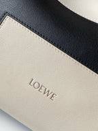 Loewe leather bag interior label area with stitched logo, light gray