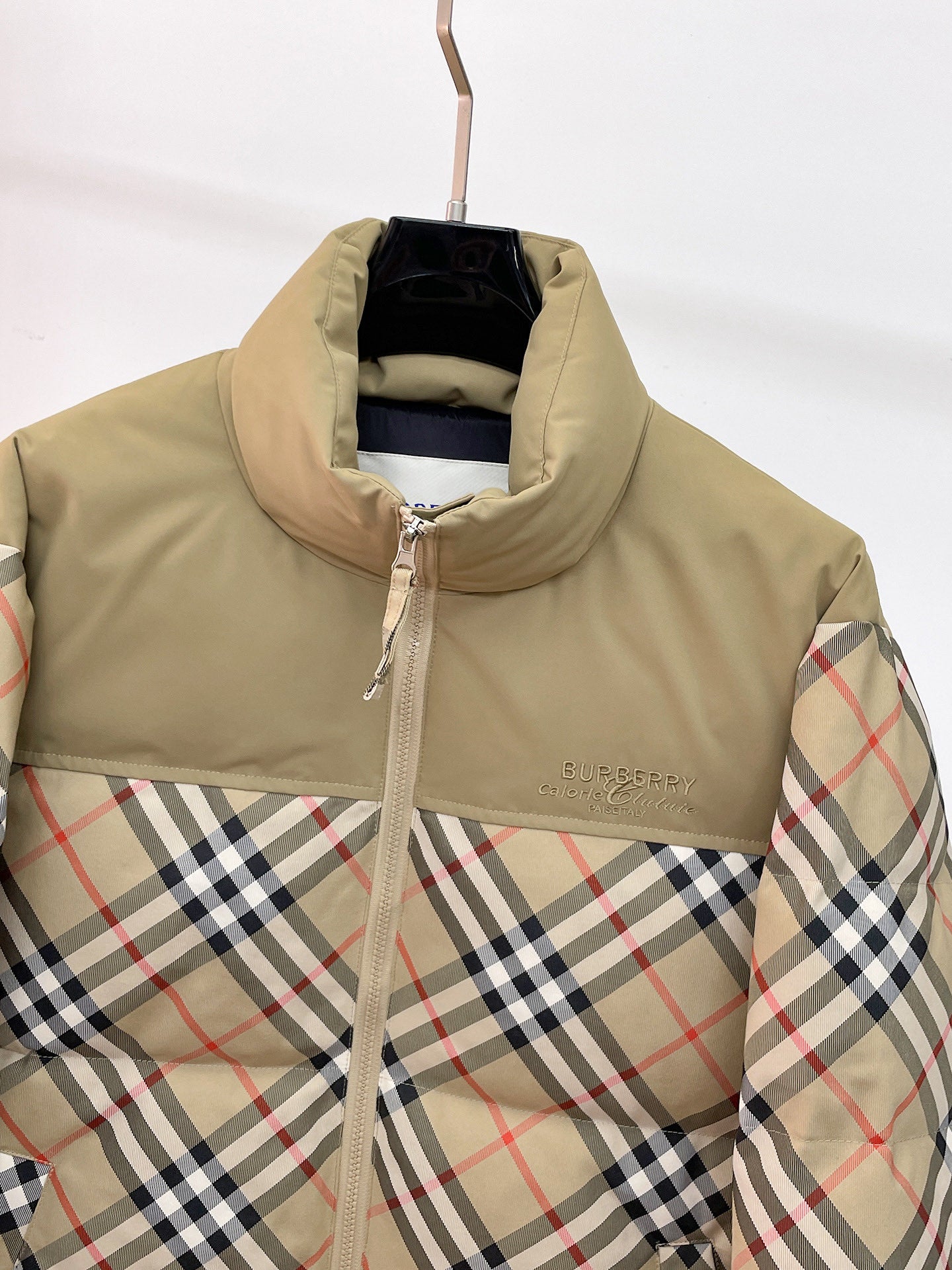 Burberry long jacket close-up of beige hood and plaid sleeves, zip front