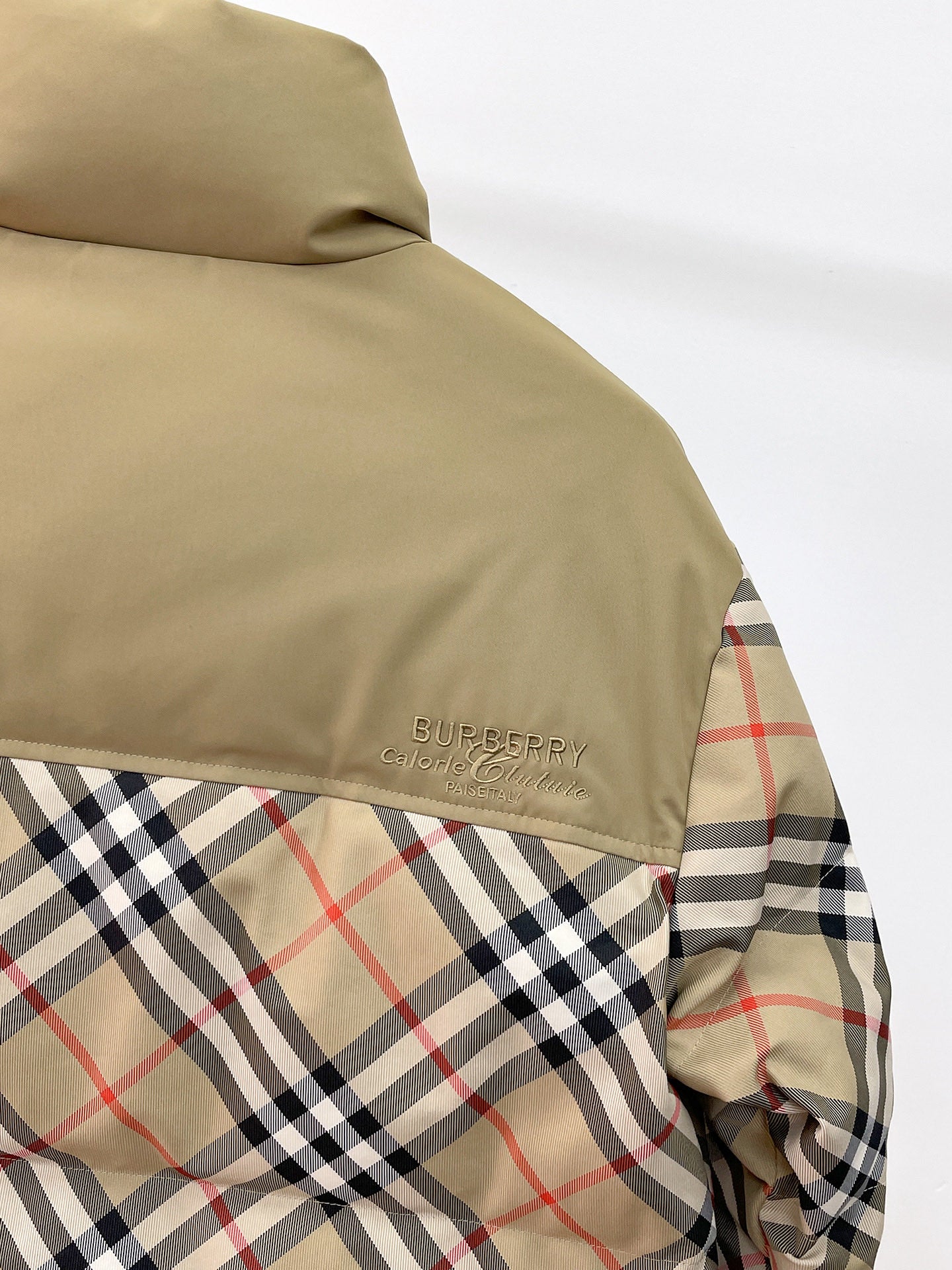 Burberry long jacket side view, beige top panel with multicolor plaid lower