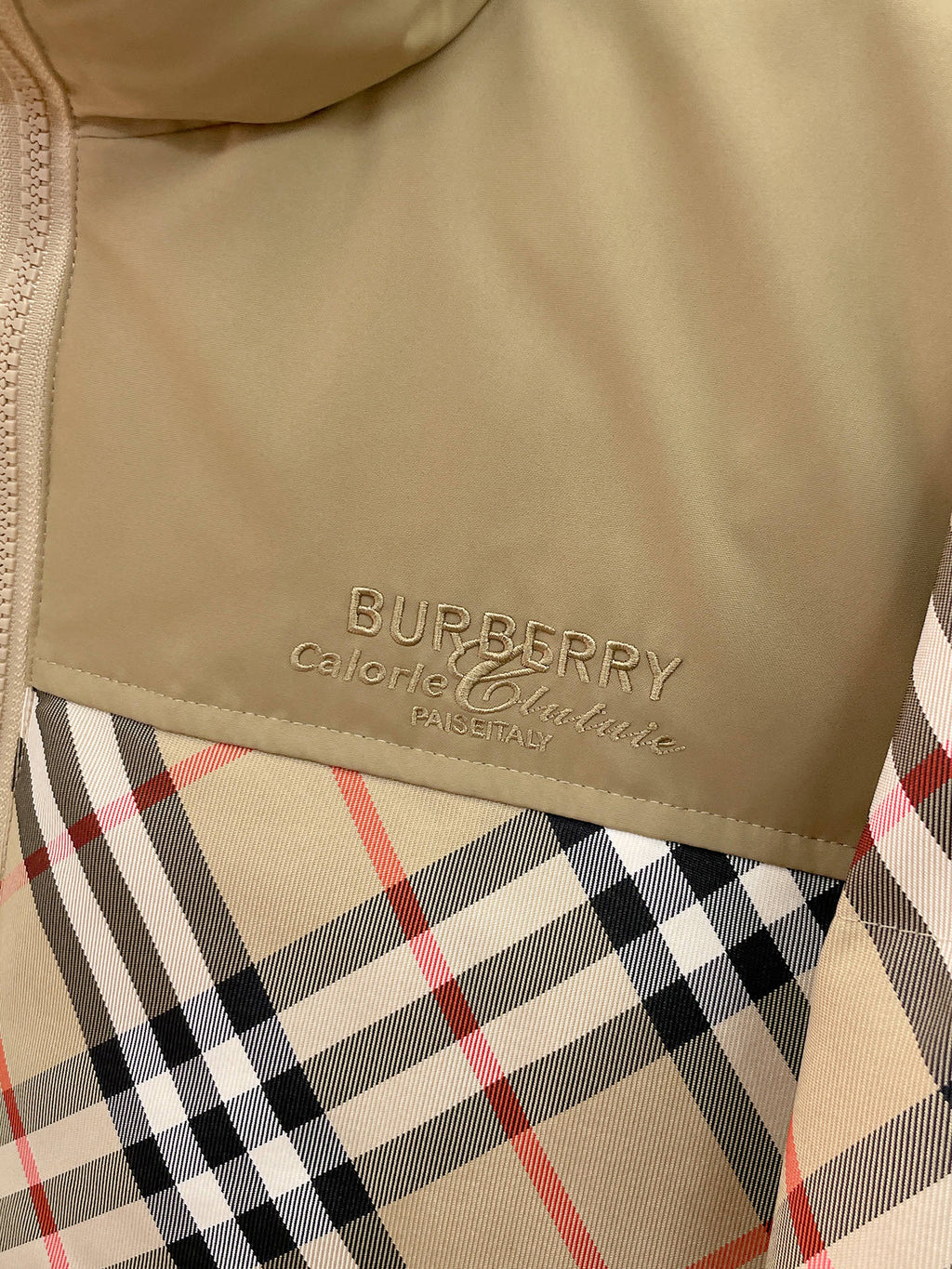 Burberry long jacket chest logo on beige panel above plaid fabric