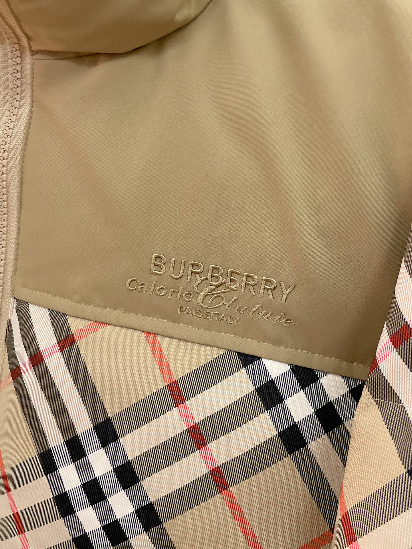 Burberry long jacket chest logo on beige panel above plaid fabric