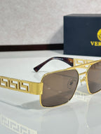 Sunglasses with gold-tone frames and brown lenses, Greek key temple pattern