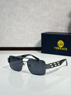 Sunglasses with silver-tone frames and dark gray lenses, black temple accents