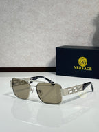 Sunglasses with gold-tone rectangular frames and brown mirrored lenses