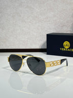 Versace aviator sunglasses with black lenses and gold frame with geometric detail