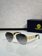 Versace aviator sunglasses with dark lenses and gold frame with emblem detail
