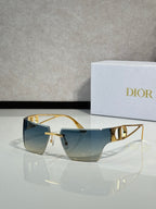 Dior sunglasses with gold frame and blue gradient lenses, front three-quarter view.