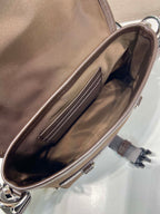 Prada brown nylon bag interior view with zip closure and side pocket