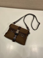 Prada dark brown nylon mini crossbody bag with two front buckled straps