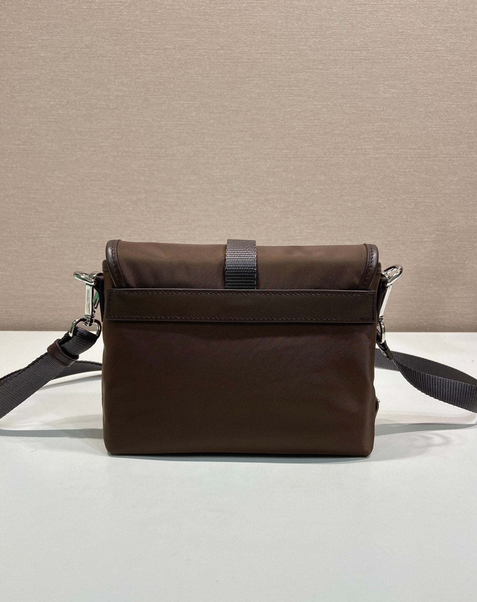 Prada dark brown nylon messenger bag with top flap and adjustable shoulder strap