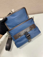 Blue crossbody bag with flap, brown trim, adjustable shoulder strap