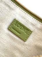 Loewe lime green leather logo patch tag on textured fabric interior