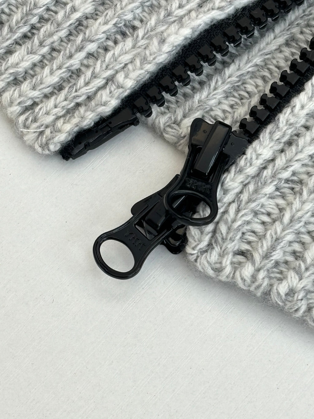 Stone Island knit fabric details with black zipper and black metal pull tab