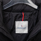 Black hooded puffer jacket lining with MONCLER logo patch on chest