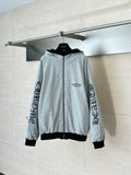 Heather gray zip-up hoodie with hood, black trim, and sleeve logo print on cuffs