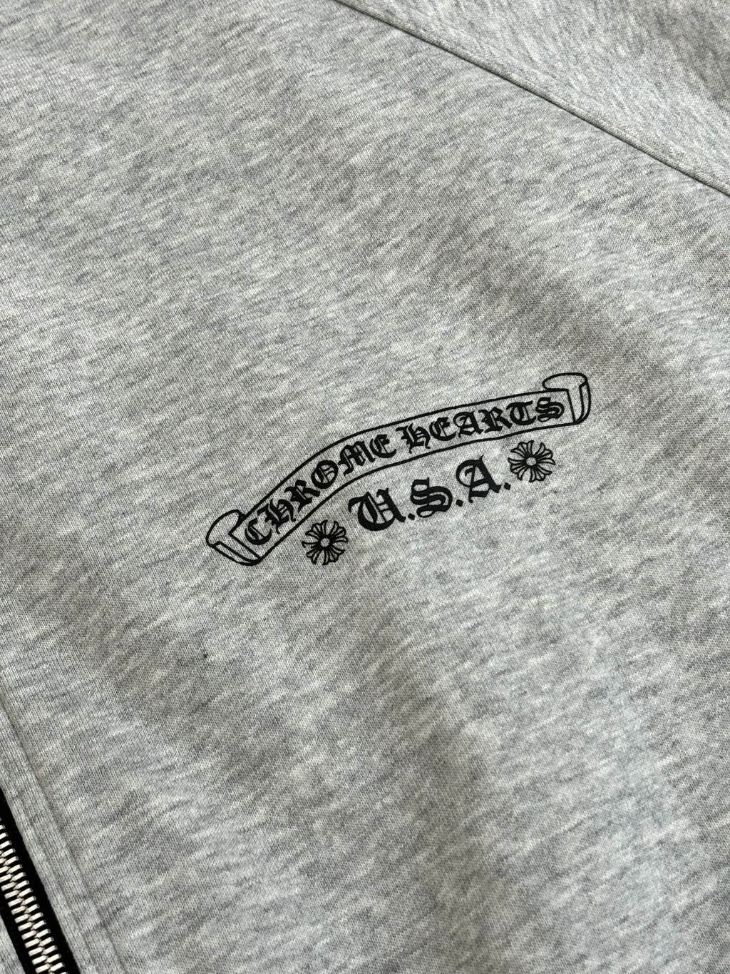 Heather gray zip-up hoodie sleeve with arched Chrome Hearts U.S.A. logo
