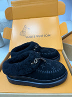 Ladies slip-on shoes with plush lining and buckle, dark monogram upper, rubber sole