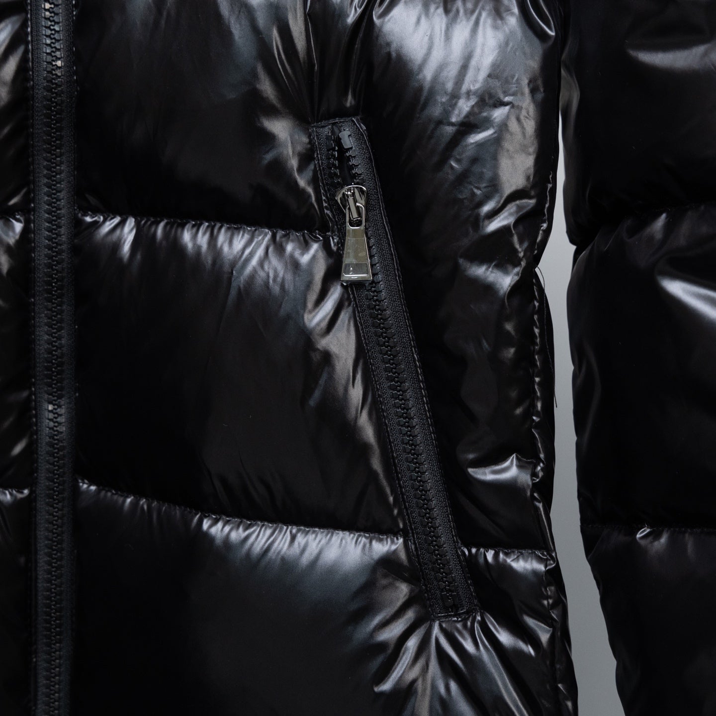 Moncler long puffer jacket front with zip and vertical seam