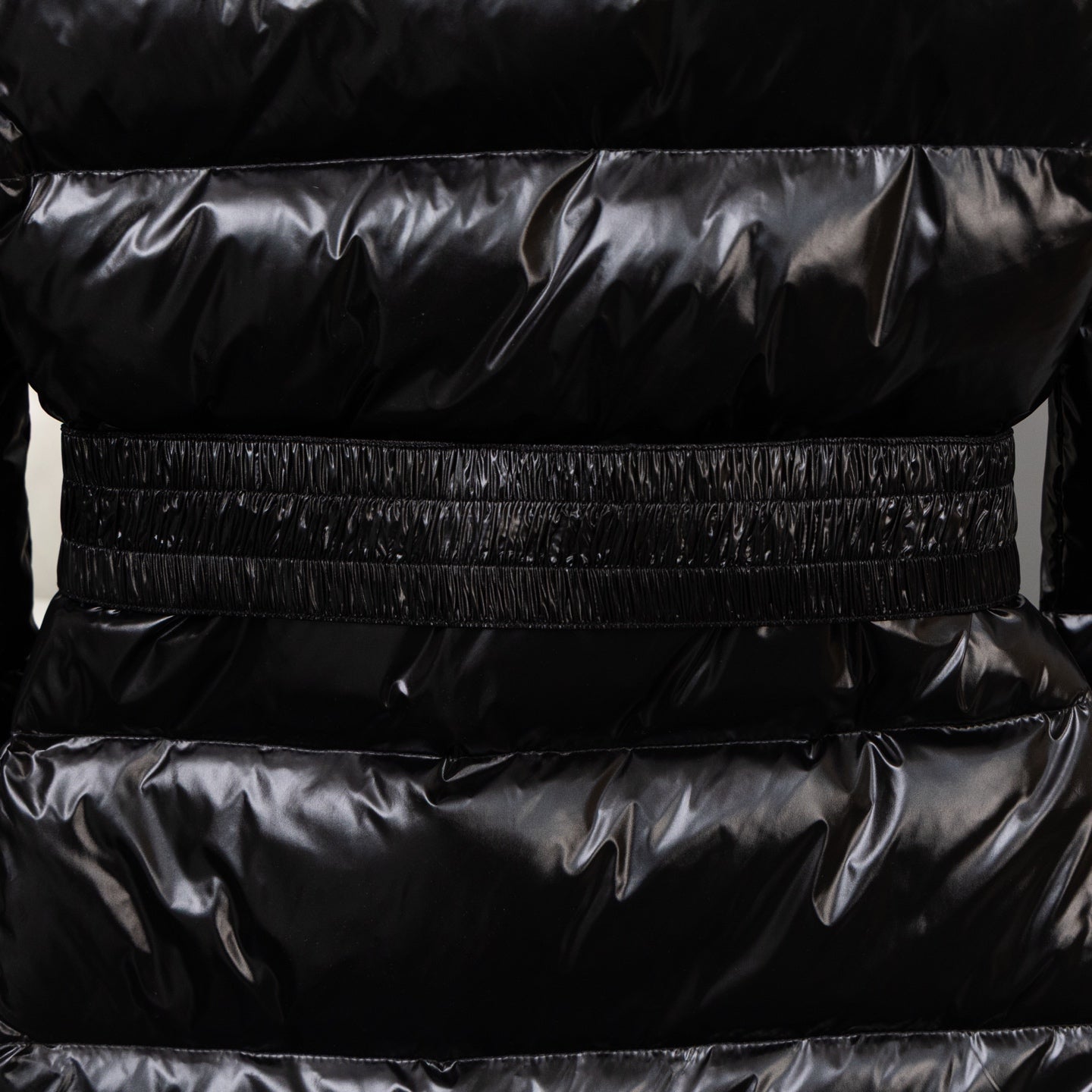 Moncler long puffer jacket with elasticated waist and quilted panels