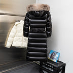 Moncler long puffer coat in black, with faux-fur hood and horizontal quilted panels