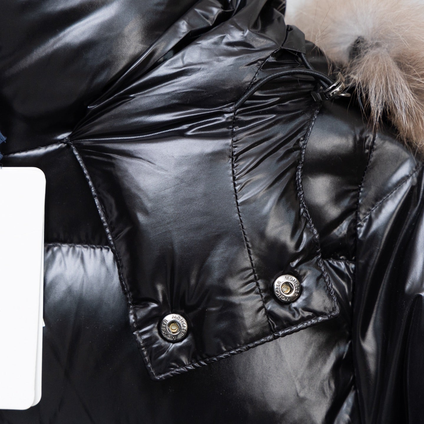 Moncler black puffer coat shoulder and chest area with snap-flap pockets