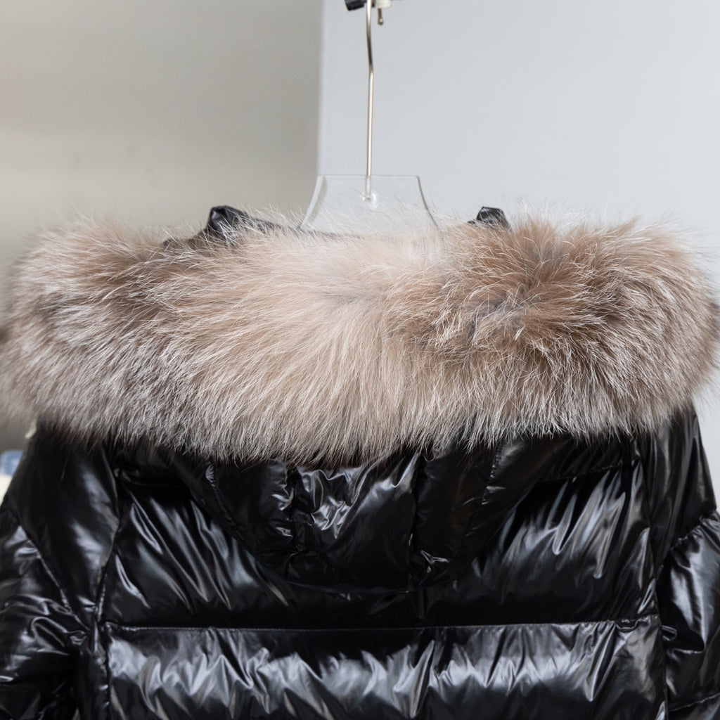 Moncler black hooded puffer coat with wide fur trim across the neckline