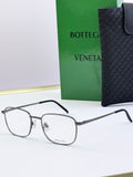 Silver eyeglass frames with clear lenses and dark gray temples