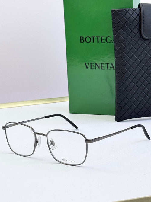 Silver eyeglass frames with clear lenses and dark gray temples