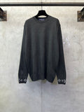 Dark gray long-sleeve crewneck sweater with logo cuff trim and patterned hems