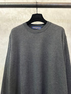 Dark gray crewneck sweater with ribbed collar and Louis Vuitton logo at neckline