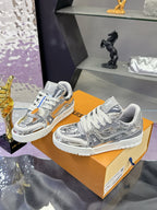 Louis Vuitton women's metallic silver sneakers on tan box, gray laces and logo tongue