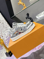 Louis Vuitton women's metallic silver low-top sneakers, white sole, gray lace-up