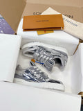 Louis Vuitton women's metallic silver sneakers in box, gray laces, side logo patch