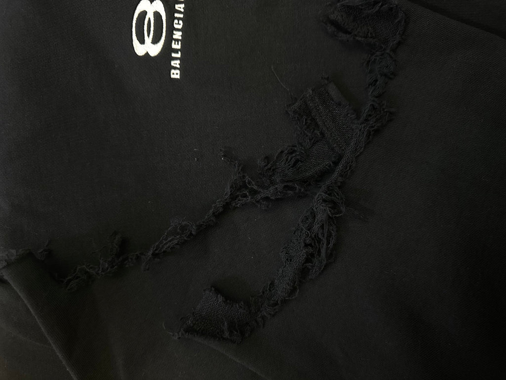 Balenciaga black fabric with frayed stitched detail near hem