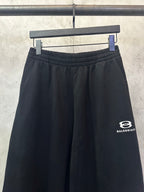 Balenciaga black wide-leg pants with elastic waistband, side logo
