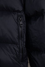 Moncler long puffer jacket front zipper detail on dark navy puffer fabric