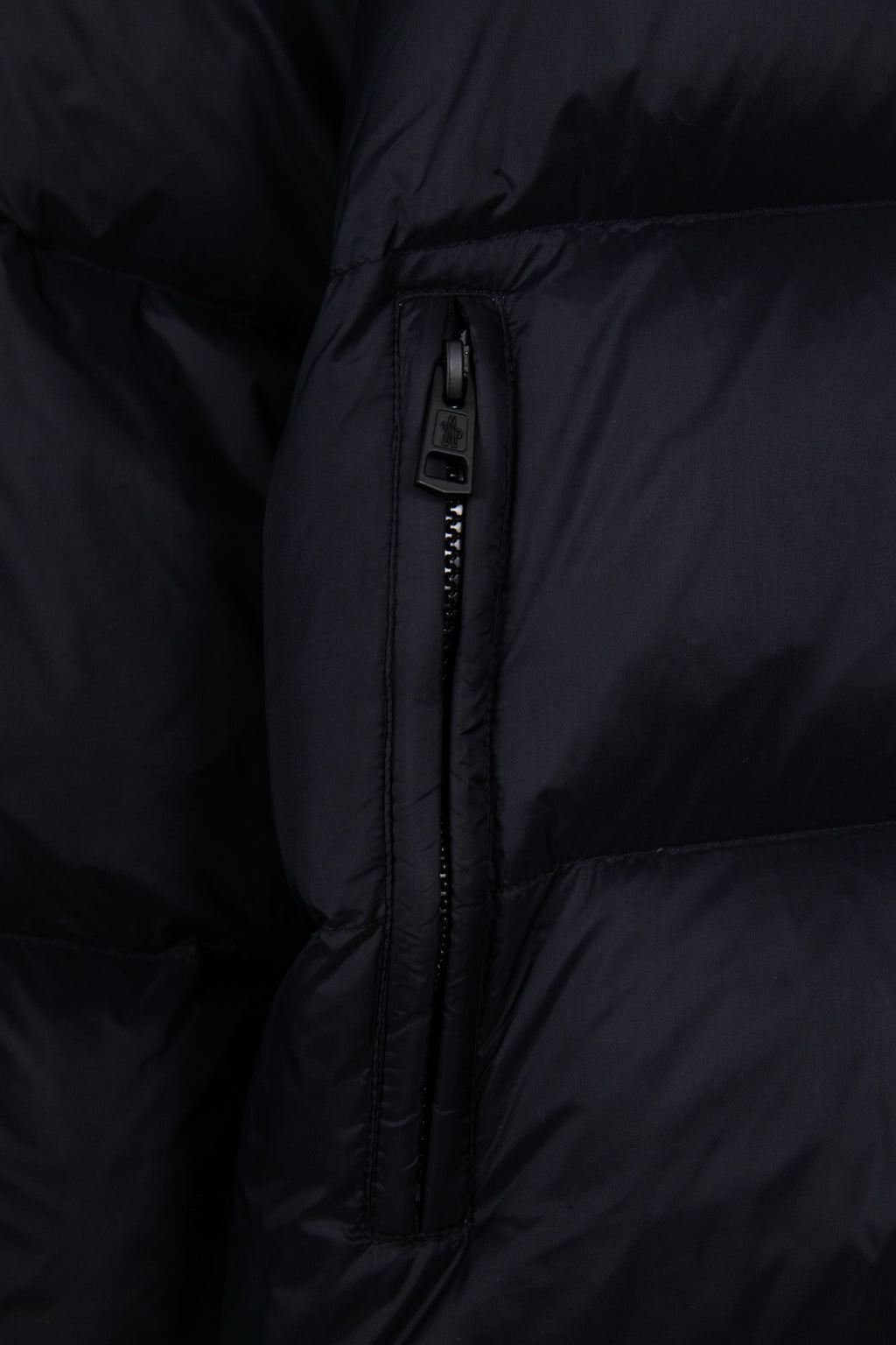 Moncler long puffer jacket center zipper with puller on dark navy quilted panel