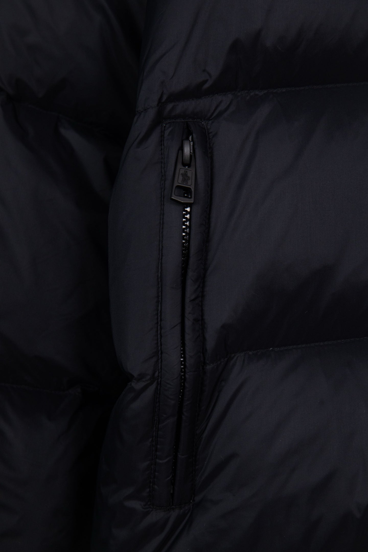 Moncler long puffer jacket center zipper with puller on dark navy quilted panel