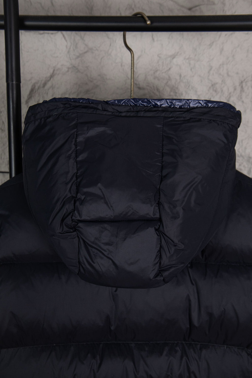 Moncler long puffer jacket back view, dark navy quilted hooded style