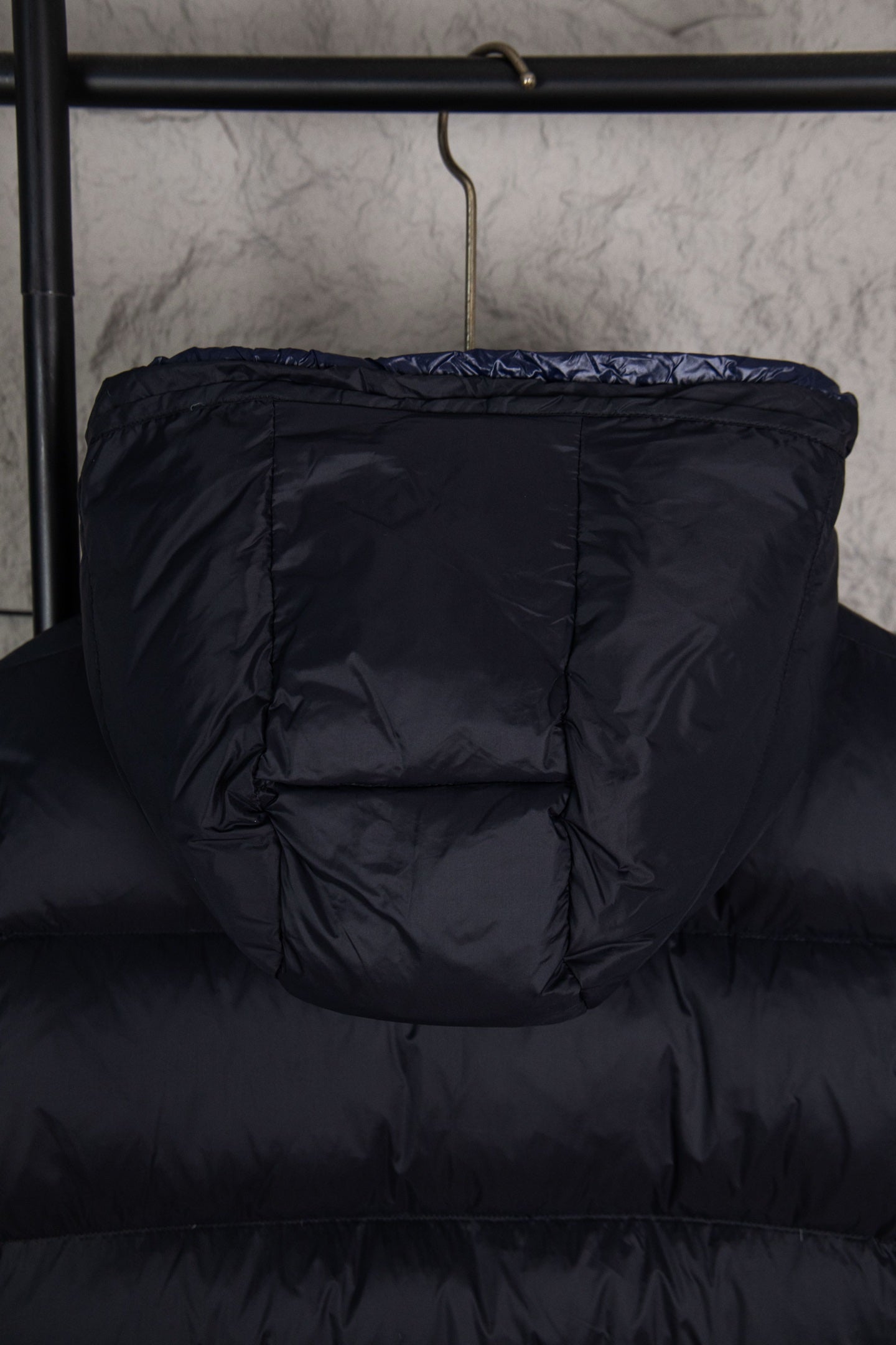 Moncler long puffer jacket back view, dark navy quilted hooded style