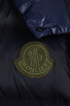 Moncler long puffer jacket chest patch logo in green on dark navy fabric