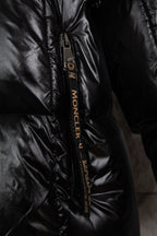 Moncler long puffer jacket zipper close-up, black with logo tape