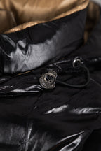 Moncler long puffer jacket close-up of snap button and cord, black