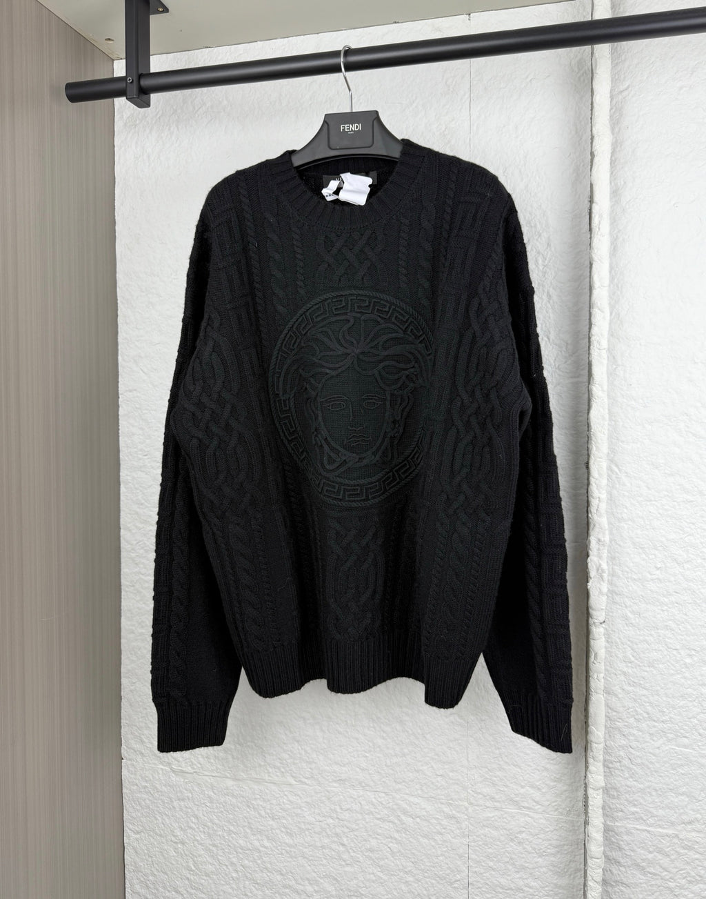 Versace black knit crewneck sweater with raised logo medallion pattern