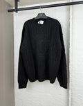 Versace black knit crewneck sweater with raised logo medallion pattern