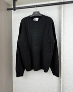 Versace black knit crewneck sweater with raised logo medallion pattern
