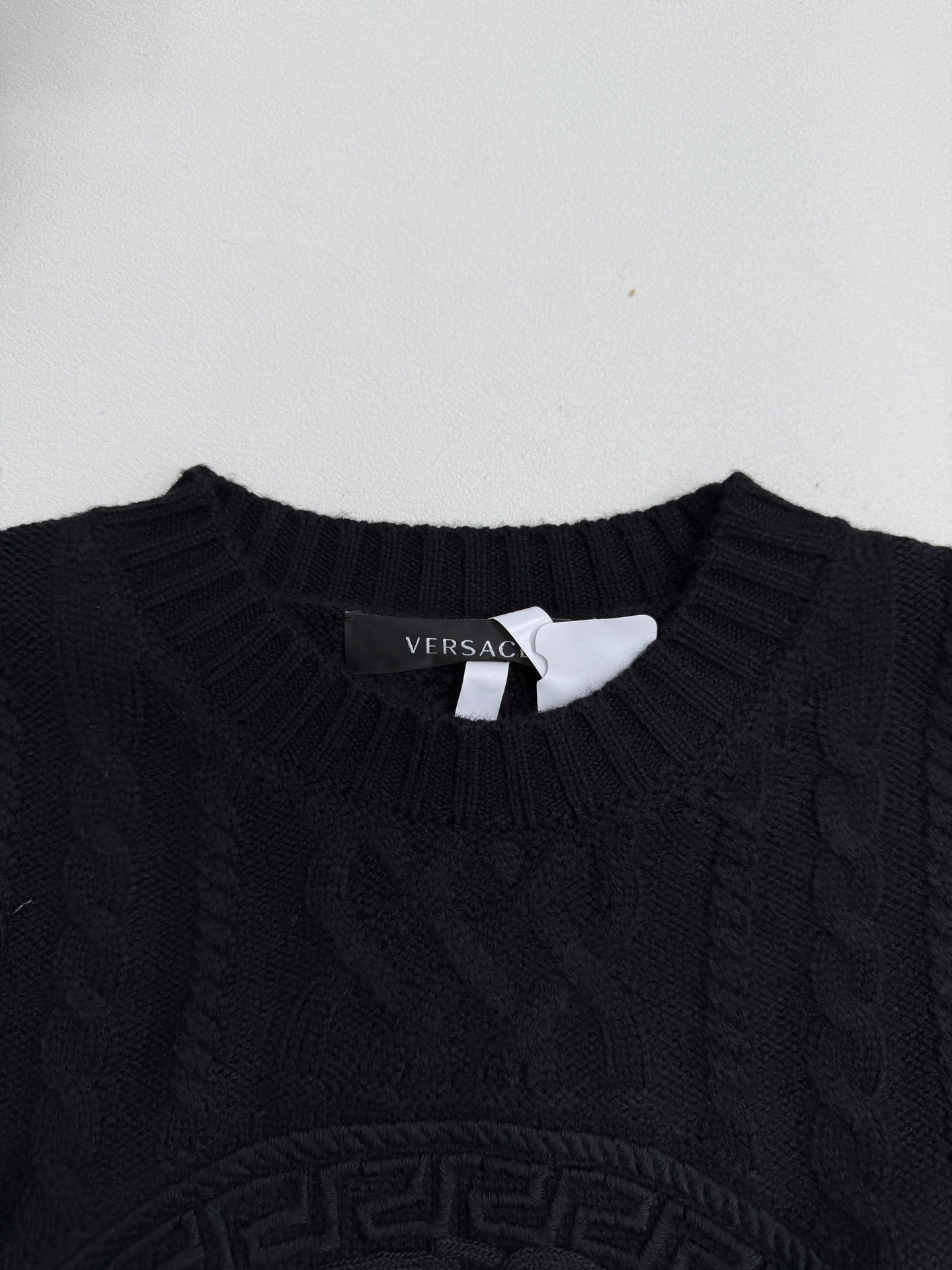 Versace black knit crewneck sweater collar with small Versace label