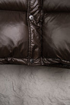 Burberry long padded jacket front placket, dark brown with snap buttons